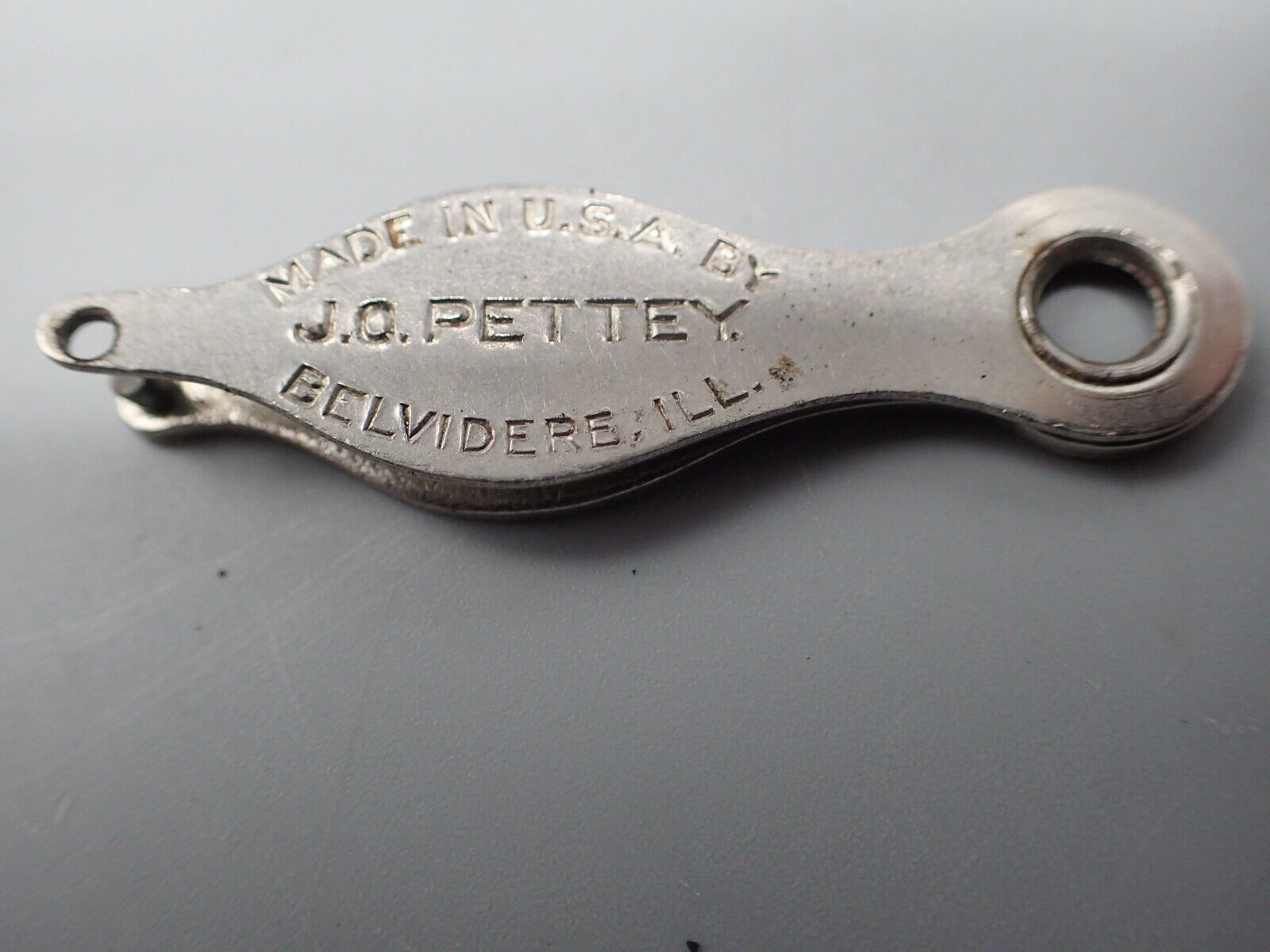 Vintage J.O. Pettey Belvidere Illinois Chicken Foot Punch Tagger Advertising 
